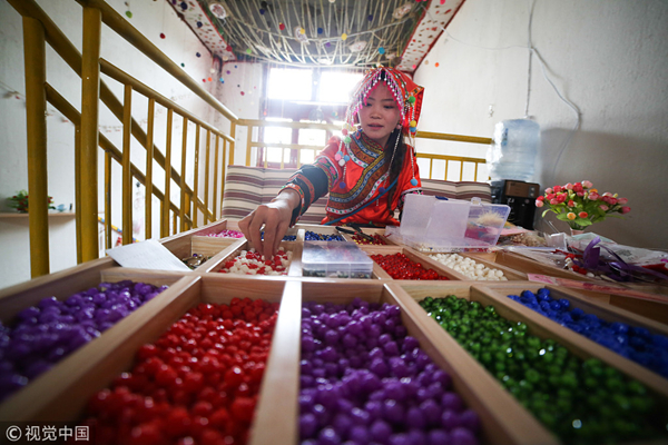 Handmade ethnic clothing grows in popularity in Southwest China