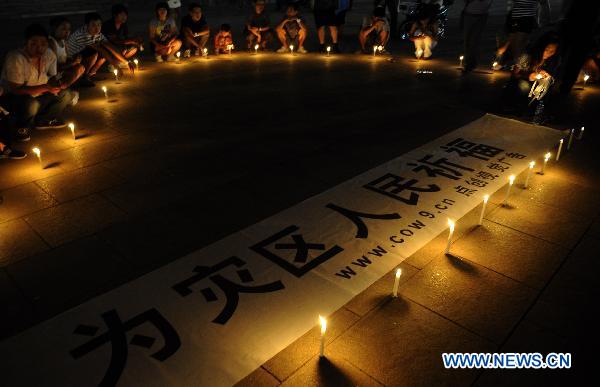 Candles lighted up to mourn for Zhouqu mudslide victims
