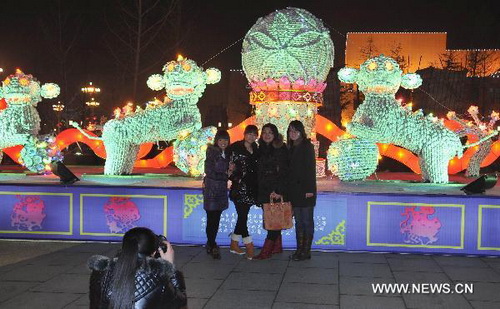 Statues made from procelain tableware exhibited in N China