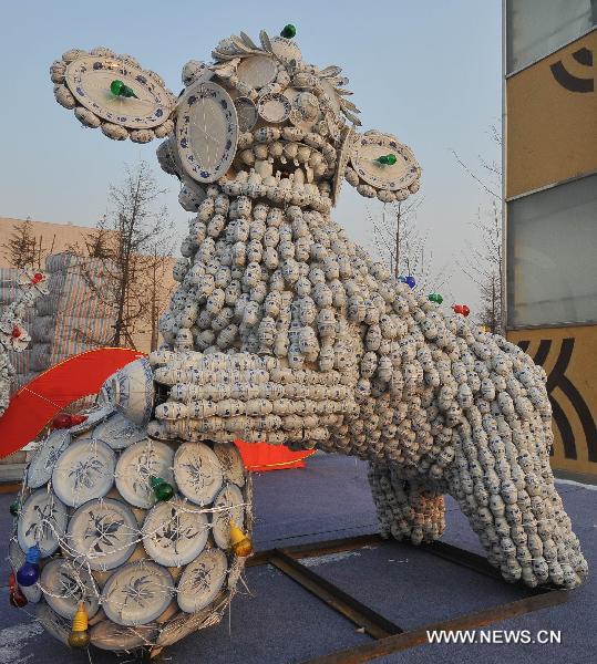 Statues made from procelain tableware exhibited in N China