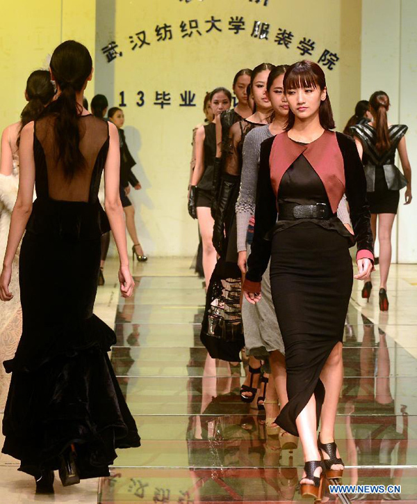 Models present creations of graduates of School of Fashion in Wuhan