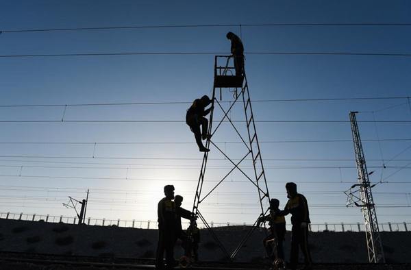 Railway workers undertake maintenance in Baotou