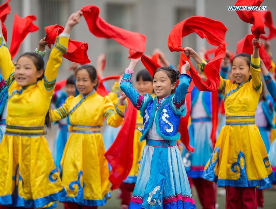 Pupils practise traditional Andai Dance in N China