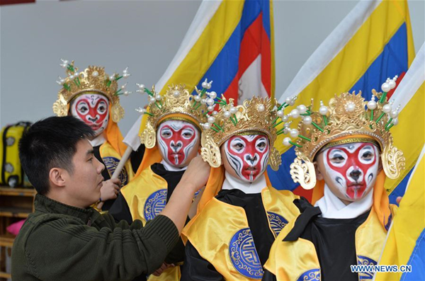 Children perform traditional Chinese Peking Opera