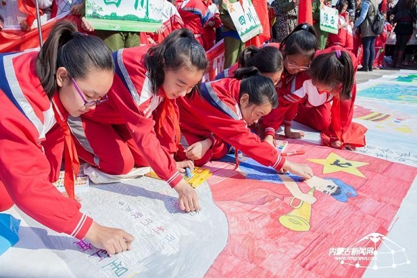 Young pupils celebrate the Long March and Chinese Young Pioneers