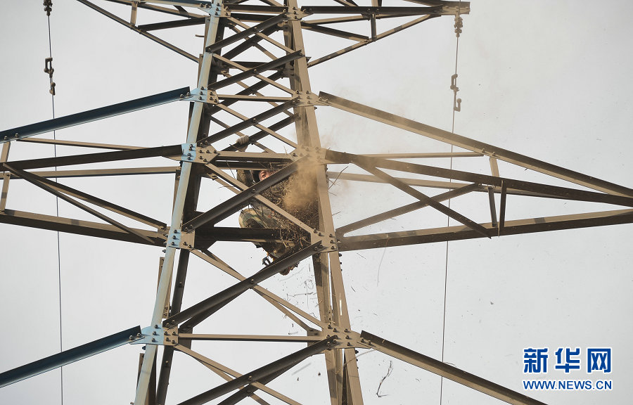 Electricians work on power lines in Wuhai