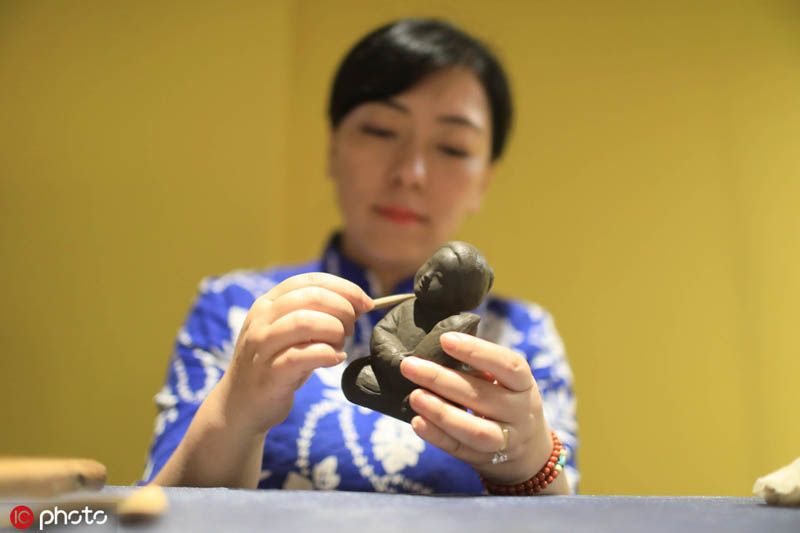 Wuxi craftsmen bring clay to life
