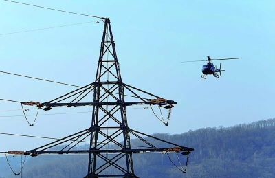 Checking power lines in NE China via helicopter
