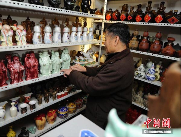 Elderly NE China man has a fascination with wine bottles