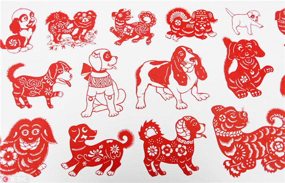 Folk artist creates long scroll of dog-themed paper-cuts