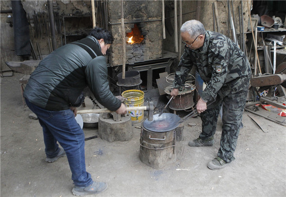 <EM>'A Bite of China'</EM> boosts sales of iron pans in E China