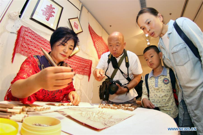 Intangible cultural heritage exhibition held in Yantai
