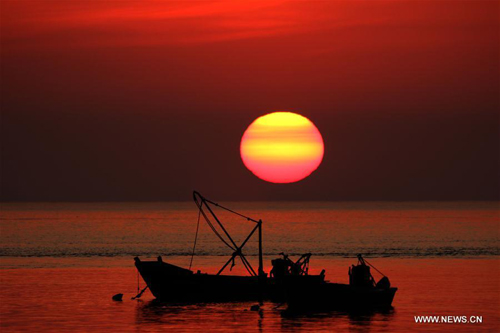 Scenery of sunrise at seaside of Penglai