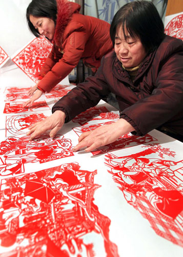 The joy of New Year carved into red paper