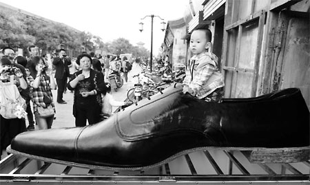 One of a pair of giant hand-stitched leather shoes in Pingyao