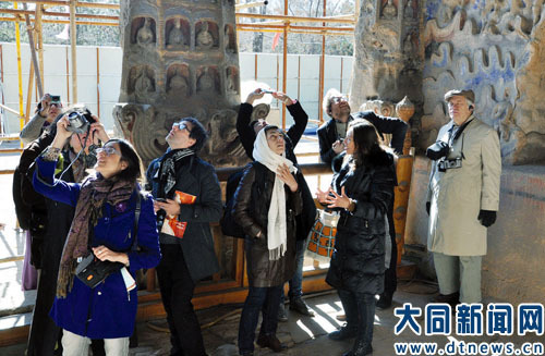 Experts study Yungang Grottoes’ music-related carvings