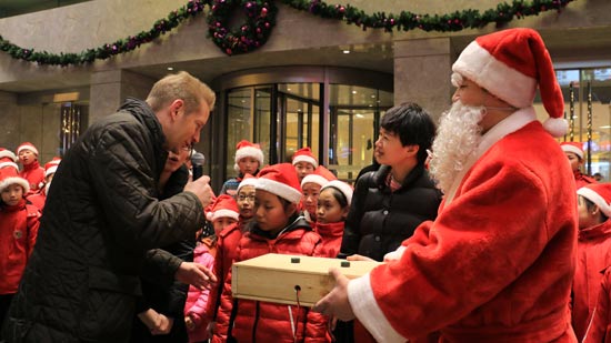 Children enjoy Christmas Tree Lighting Ceremony at Kempinski Hotel