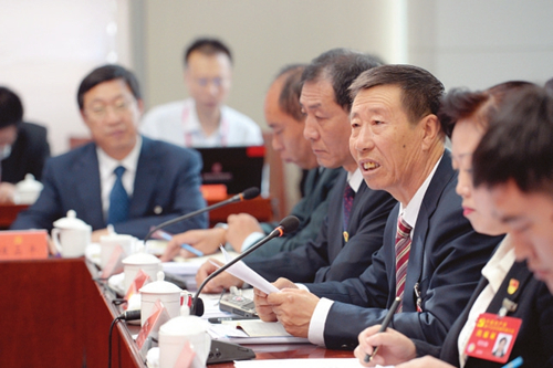 Shanxi congress delegates discuss report