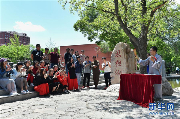 Shanxi students promote traditional culture to mark Youth Day