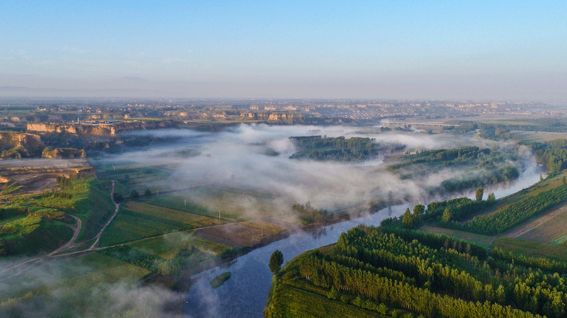 Fenhe River in mist looks like picturesque Chinese ink painting