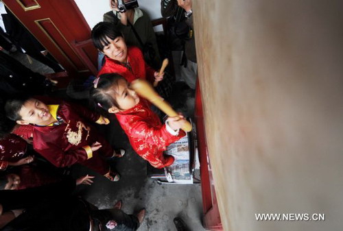 Chilidren take part in traditional first writing ceremony