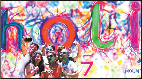 Revelers add splash of color to annual festival