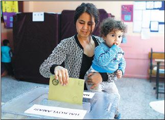 Turks vote on expanding Erdogan's power