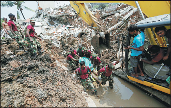 Hope fades for missing in Sri Lanka; anger grows as garbage toll hits 23