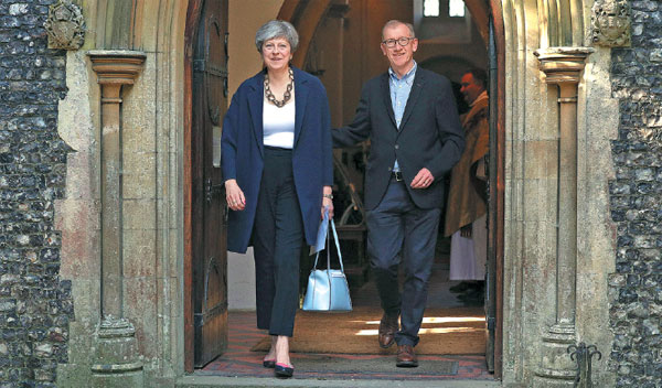 Embattled May unveils cabinet