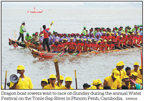 Tens of thousands of Cambodians cheer for centuries-old boat races