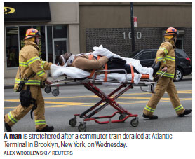 100 hurt as New York rush hour train derails