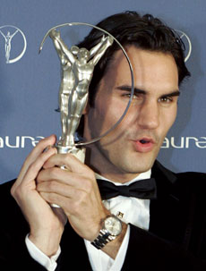 Swiss tennis player Roger Federer holds the Laureus Sportsman of the Year award at the Mariinsky Theatre in St Petersburg February 18, 2008. Tennis world number one Roger Federer won the prestigious Laureus Sportsman of the year award for a record fourth year in a row on Monday. [Agencies]