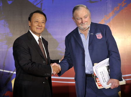 Li Furong (L) of China and Tim Boggan of US, who both took part in &apos;Ping-pong diplomacy&apos; in 1971, shake hands during a press conference in South China&apos;s Guangzhou, Feb. 24, 2008. During the event, Chinese sportswear company Li Ningannounced its sponsorship deal with the US national table tennis team for the next five years. [Xinhua]