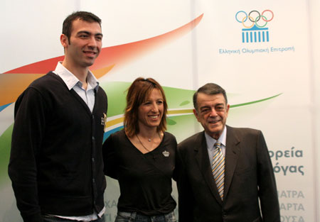 (L to R) Alexandros Nikolaidis, the first torchbearer for the Beijing Olympic Games, Minos Kyriakou, President of the Hellenic Olympic Committee(HOC), and Pigi Devetzi, who will light the Olympic Flame at the altar of the Panathenian Stadium on March 30 before handing over the flame to the Beijing Olympic Organizing Committee (BOCOG), attend a press conference in Athens, March 13, 2008. HOC on Thursday confirmed the journey of the Olympic Flame in Greece and revealed the program of the Torch-lighting Ceremony. The flame will be lit in Ancient Olympia at 12 noon on March 24 and will be handed over to BOCOG at 3 pm on March 30 at the Panathenian Stadium in Athens. [Xinhua] 