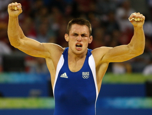 France's Steeve Guenot jubilates after defeating Kazakhstan's Darkhan Bayakhmetov in their men's Greco-Roman 66 kg semi-final wrestling match for the 2008 Beijing Olympic Games on August 13, 2008.