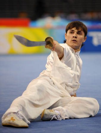 Andrii Koval of Ukraine performs during men's Daoshu (broadsword play) of the Beijing 2008 Wushu Competition in Beijing, China, Aug. 21, 2008. Andrii Koval ranked 8th in men's Daoshu competition with a score of 9.35. (Xinhua/Chen Yehua)