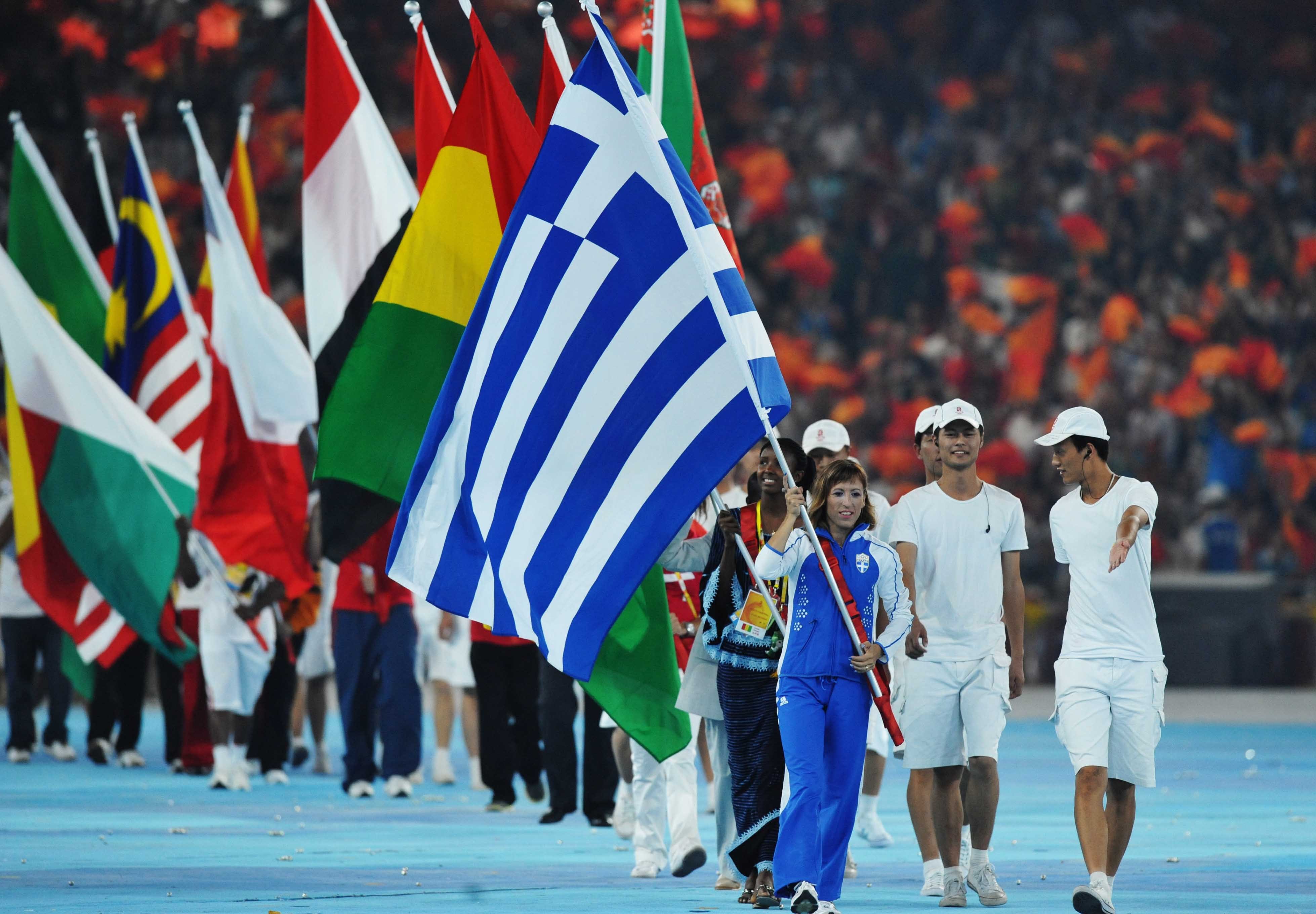 Flag bearers and Olympic delegations parade