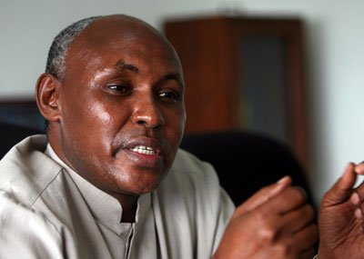 Filbert Bayi, secretary general of the Tanzanian Olympic Committee (TOC), speaks during an interview with Chinese media, April 10, 2008. [Xinhua]