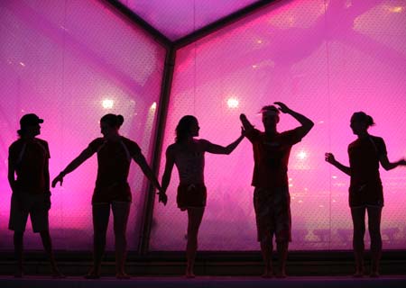  Canadian swimmers pose for group photos in the National Aquatics Center, or the Water Cube, in Beijing, China, Sept. 15, 2008. The Beijing 2008 Paralympic Games swimming event finished here on Tuesday.