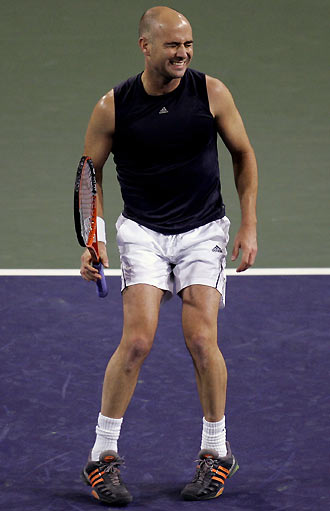 Andre Agassi of the U.S. reacts after losing a point during his game against Tommy Haas of Germany at the Pacific Life Open tennis tournament in Indian Wells, California March 13, 2006. [Reuters]