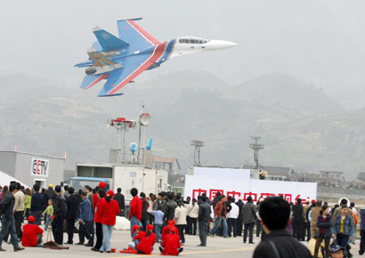 A Su-27 fighter jet from the Russian Knights Aerobatic team performs near Tianmen Cave in Hunan Province's Tianmenshan National Park, China March 19, 2006. Russian pilots from the Russian Knights Aerobatic team performed their acrobatic skills in China's Hunan Province. 