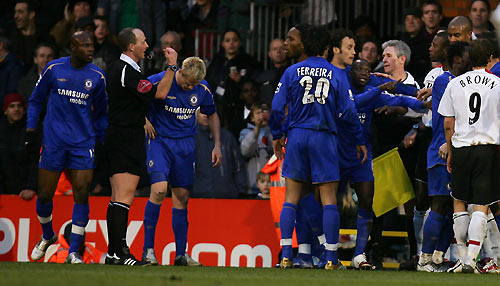 Chelsea and Fulham players argue after Chelsea's William Gallas (unseen) was shown the red card during their English Premier League soccer match against Fulham at Craven Cottage in London March 19, 2006. Fulham won the match 1-0. [Reuters]