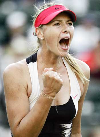 Maria Sharapova of Russia celebrates after winning her match against Maria Elena Camerin of Italy at the Nasdaq-100 Open tennis tournament in Key Biscayne, Florida March 26, 2006. Sharapova defeated Camerin 6-2 7-6.