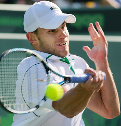 Andy Roddick of the U.S. hits a forehand shot against David Ferrer of Spain during their quarter-final tennis match at the Nasdaq-100 Open in Key Biscayne, Florida March 30, 2006.