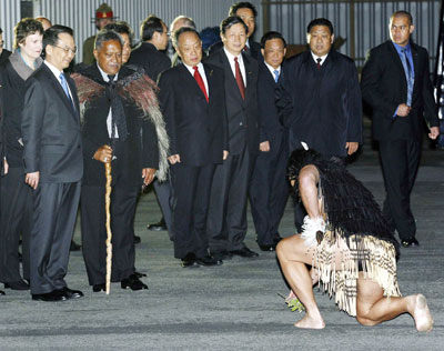 Chinese Premier Wen Jiabao (2nd L) receives a Maori challenge upon his arrival as Kaumatua (Maori elder) John Tahuparae (3rd L) looks on in Wellington, New Zealand April 5, 2006. 