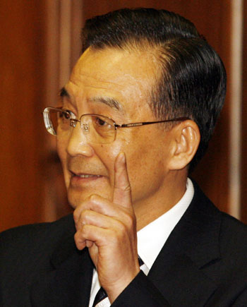 Chinese Premier Wen Jiabao responds to media questions during a news conference with New Zealand's Prime Minister Helen Clark in Wellington April 6, 2006. 
