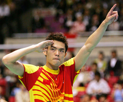 World number one Lin Dan of China celebrates his win over Denmark's Peter Gade at their finals of the Thomas Cup badminton tournament in Tokyo May 7, 2006. 
