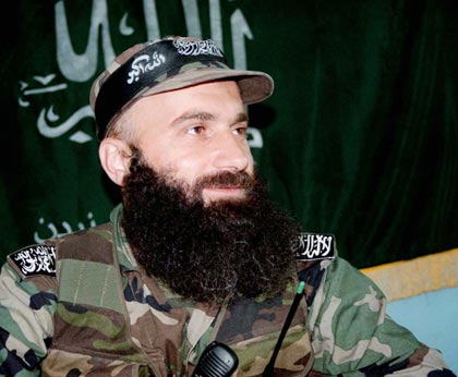Chechen warlord Shamil Basayev attends a news conference in the village of Ansalta in Botlikhsky district of Dagestan in southern Russia in this August 12, 1999 file photo. Russia's most wanted man, Basayev, has been killed, the country's state security chief has told President Vladimir Putin, Itar-Tass news agency said on Monday. [Reuters]