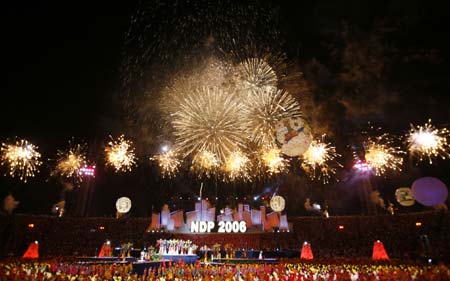 Fireworks explode over National Stadium during the National Day Parade in Singapore August 9, 2006. 