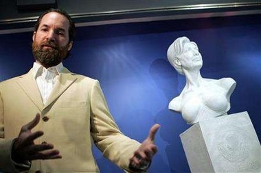 Artist Daniel Edwards talks about his sculpture 'The Presidential Bust of Hillary Rodham Clinton: the First Woman President of the United Stated of America' at the Museum of Sex in New York August 9, 2006. Edwards claims to have been inspired to make the piece after actress Sharon Stone said Clinton could never be president because she is a sexual being.